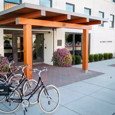 View of Inn at Lynden exterior with wood entrance.