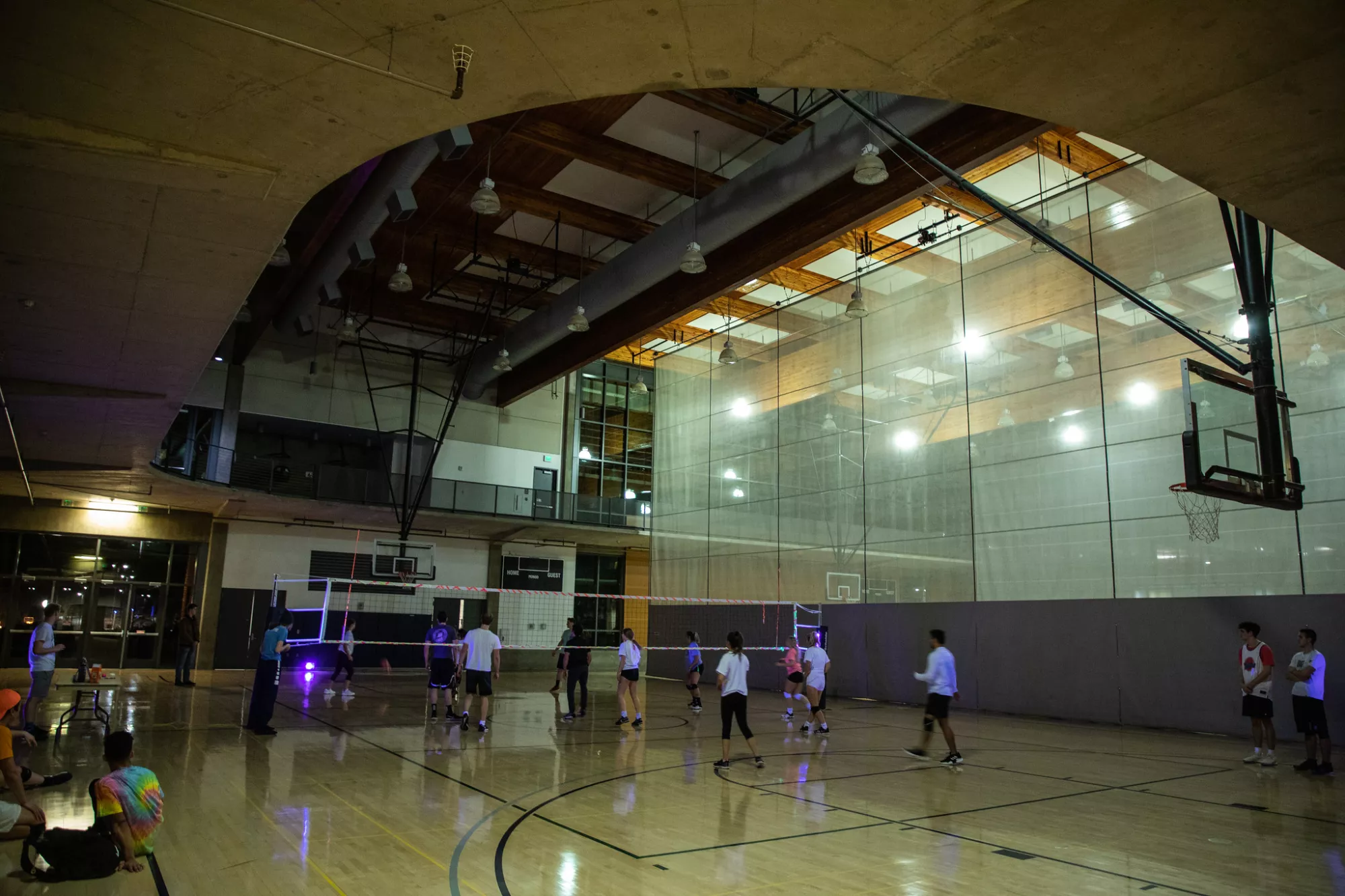 Students playing basketball in a gym in the Wade King rec center