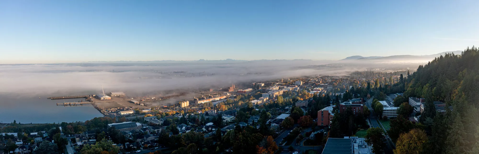Aerial drone image of Western campus on a misty morning day.