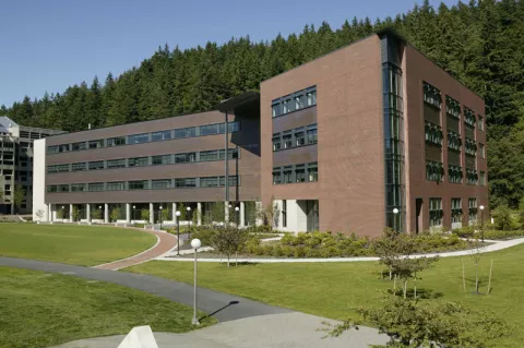 Communications Facility, a four story building with a brick and rusted metal facade