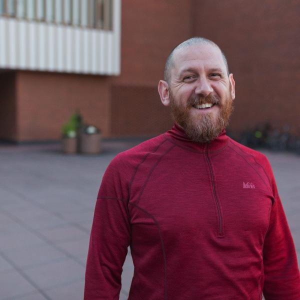 Chris Casquilho standing in front of the Performing Arts Center