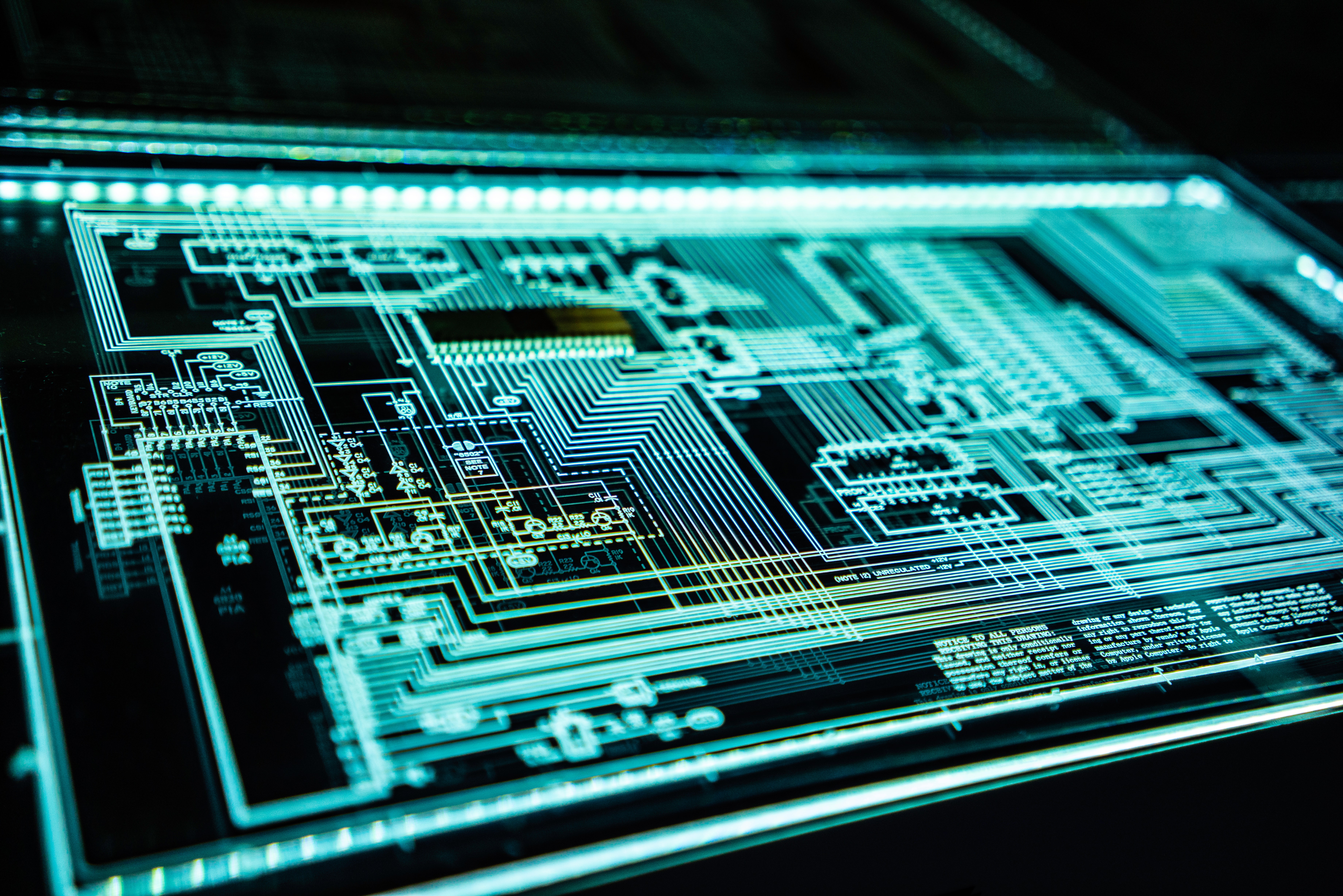 A neon turquoise circuit board