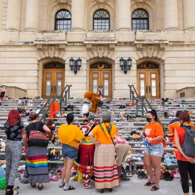 A memorial of hundreds of children's shoes on the steps of the Saskatchewan Legislative Building.