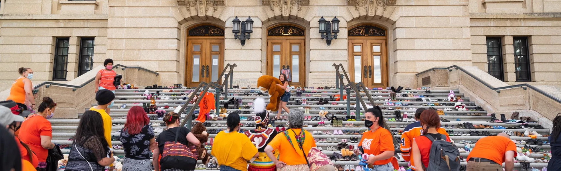 A memorial of hundreds of children's shoes on the steps of the Saskatchewan Legislative Building.