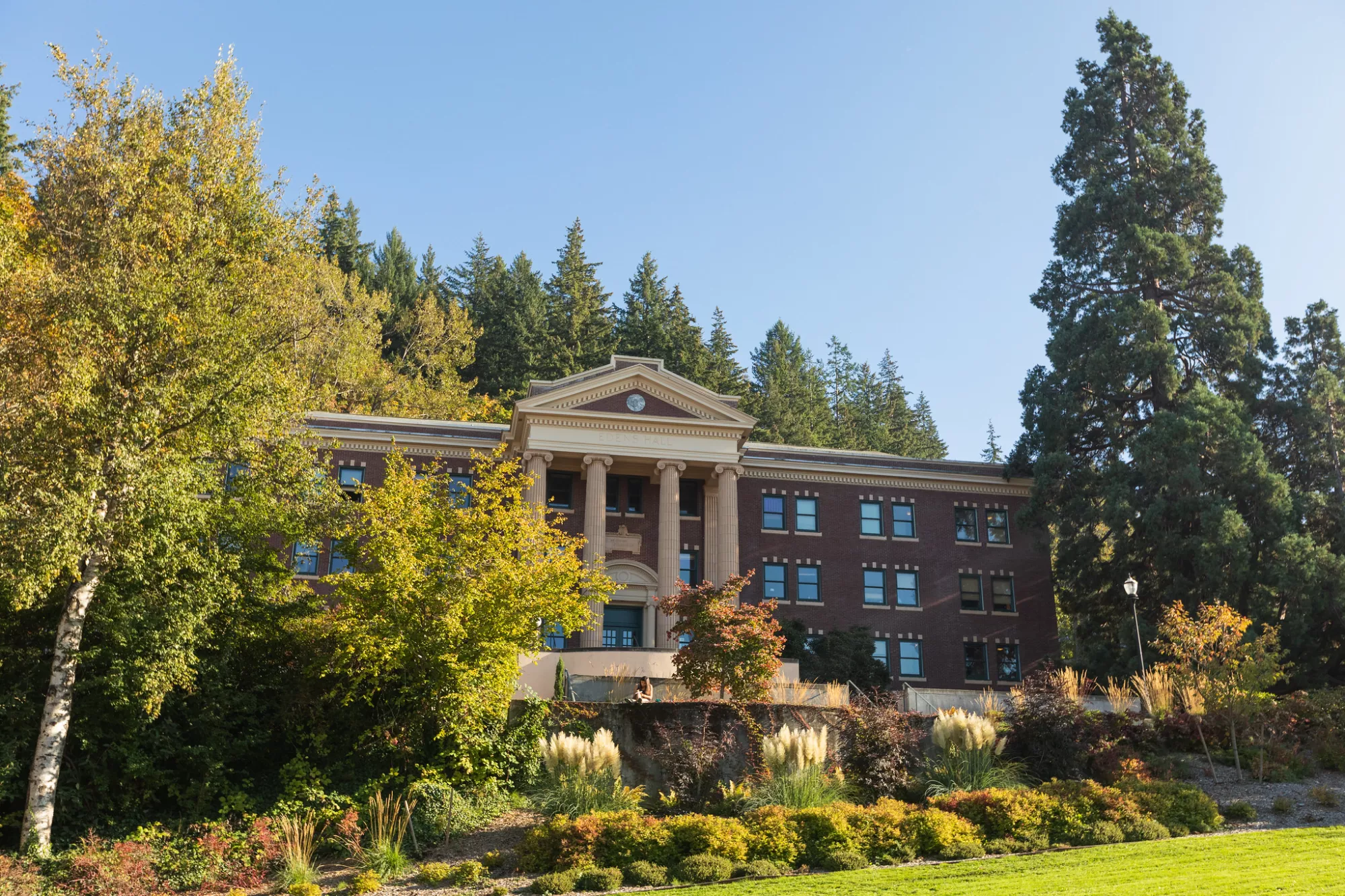The front of Eden's Hall, which features a brick facade and ionic columns