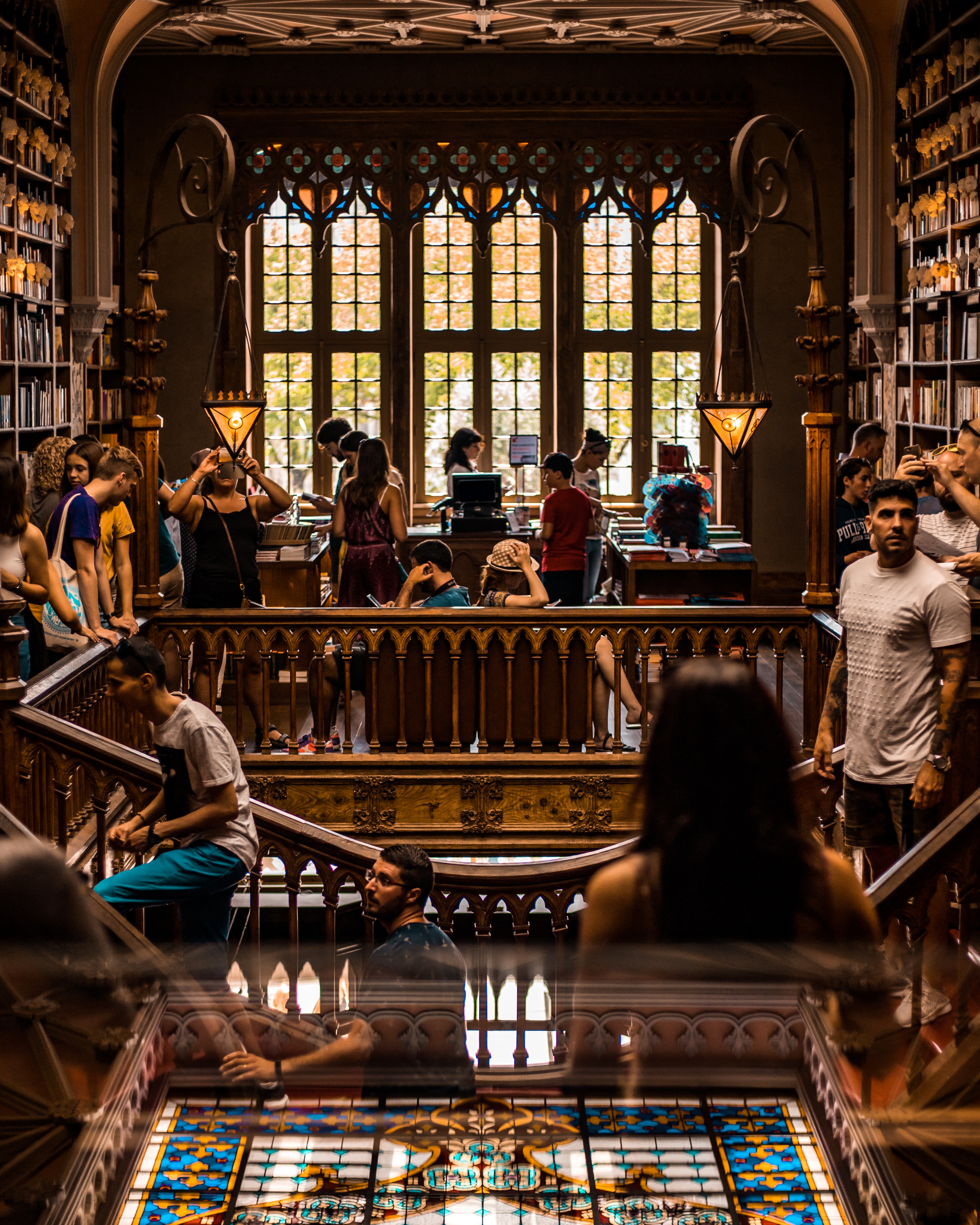 Students studying in an old, wood trimmed library