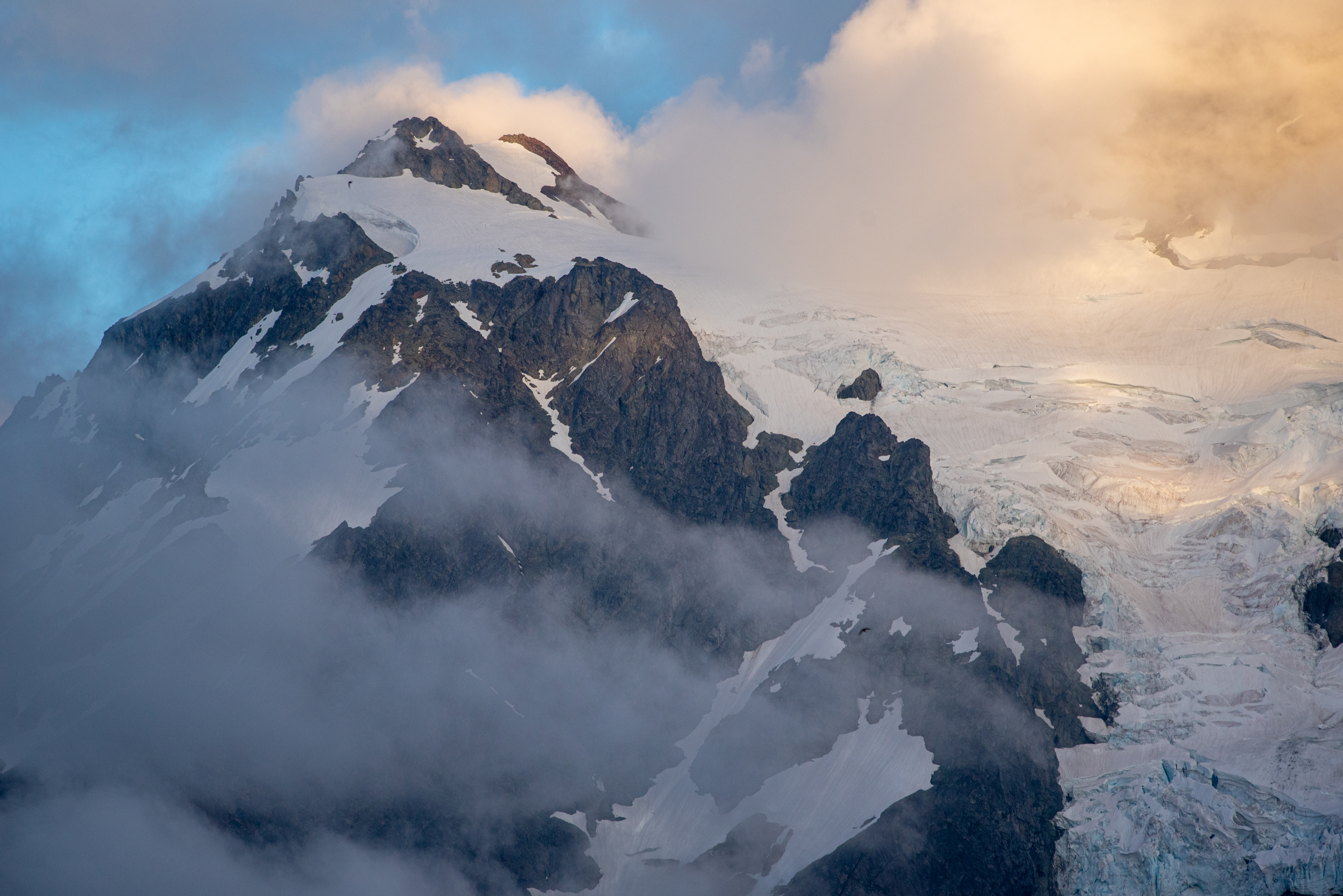 Peak of a mountain in the clouds.