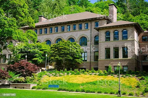 Old Main, a brick building surrounded by trees.