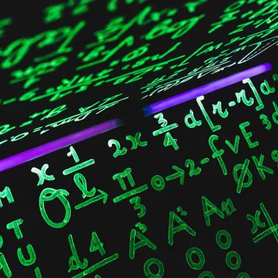 Green math equations illuminated by a uv light