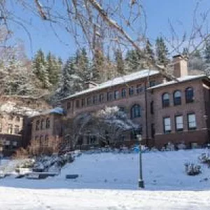 Old Main against a snowy front lawn