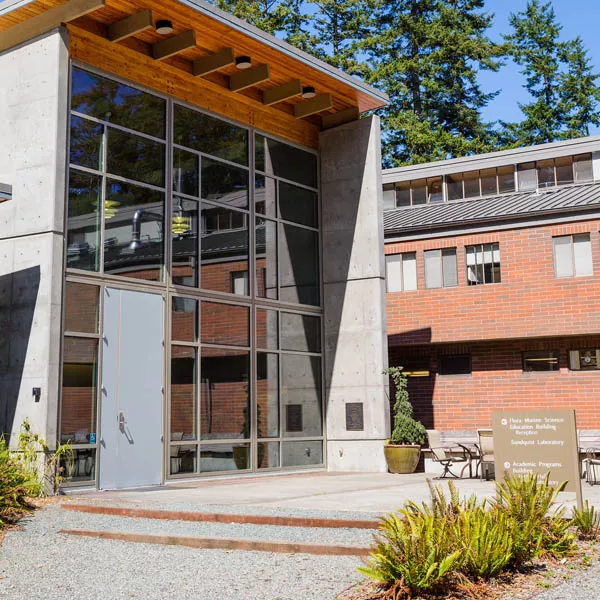 Outside of the Shannon Point Marine Center. The building is modern and features glass and exposed concrete.