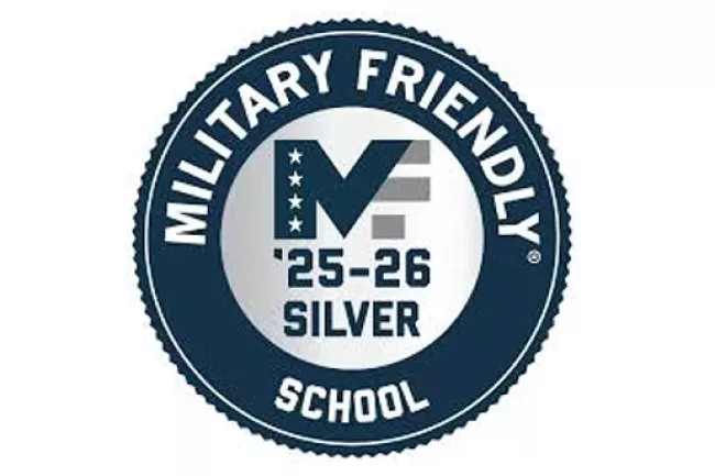 Military Friendly® School award. '25-'26 Silver designation. A dark-blue circular seal with a silver MF logo at the center.