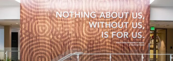 Wall in the multicultural center with the words, "Nothing about us, without us, is for us"