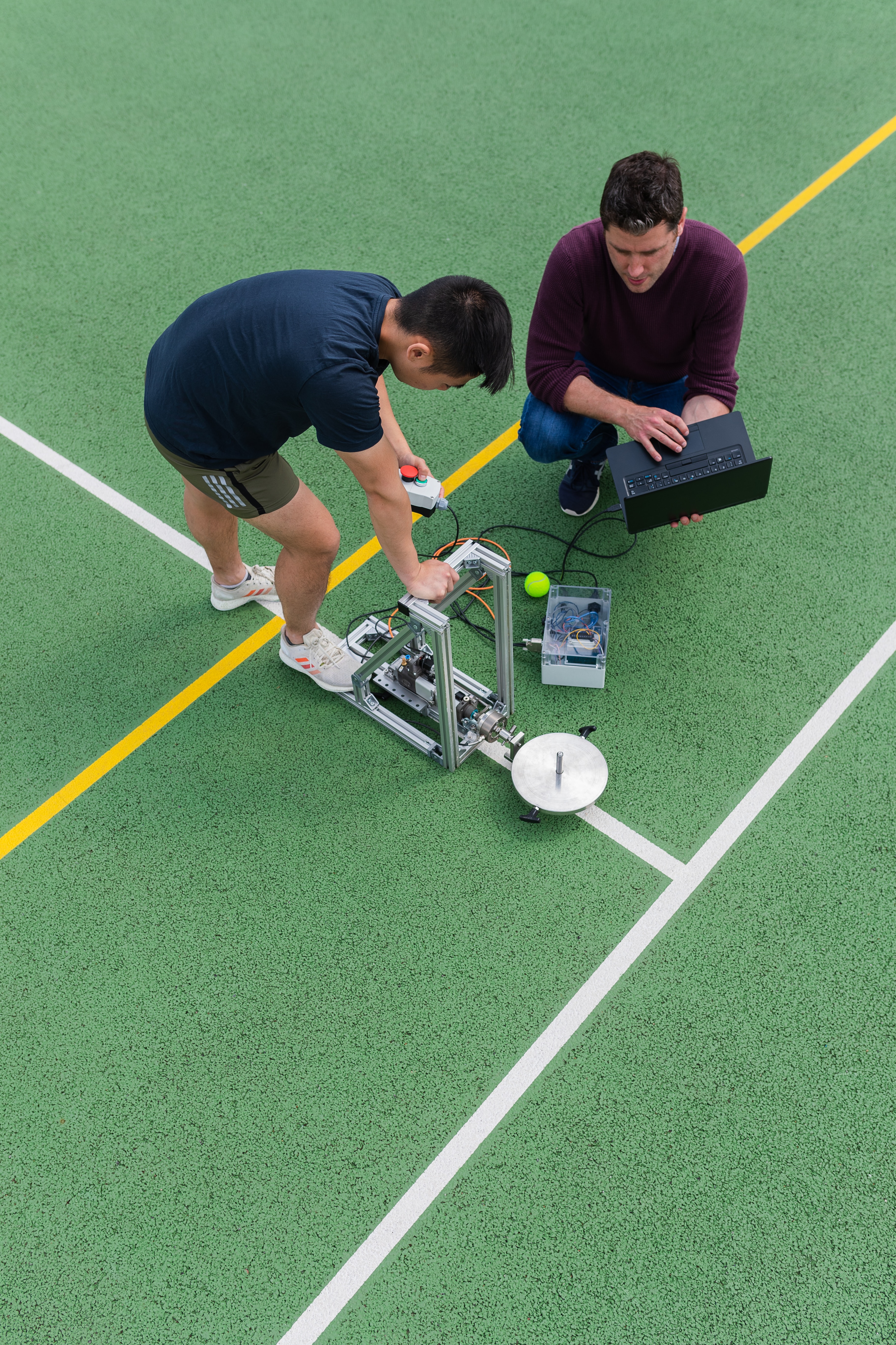 Soccer player working with research equipment on the field