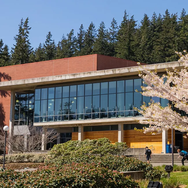 Wade King Recreation Center is a two-story building with floor-to-ceiling glass on the second floor.